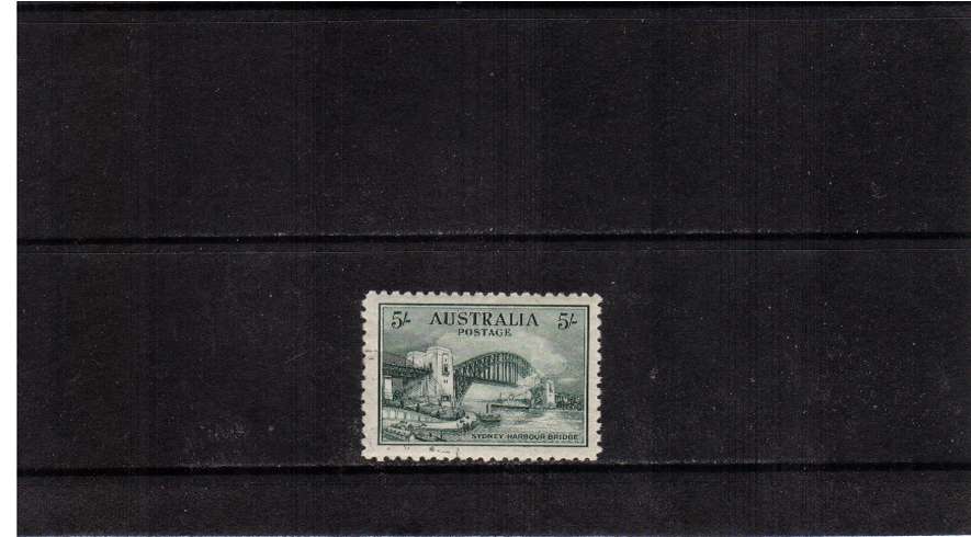 The famous ''Sydney Harbour Bridge'' 5/- Blue-Green superb fine used with a very light SW corner cancel. Ironically the stamp is unmounted mint!