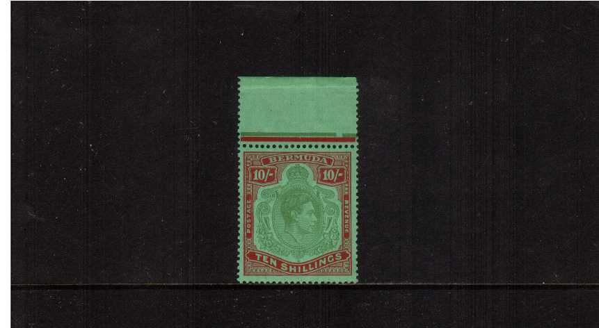 10/- Yellowish Green and Deep Carmine Red on Green - Ordinary Paper.<br/>
A top marginal unmounted mint stamp with tiny dealers mark on back. SG Cat 70
<br/><b>AQG</b>