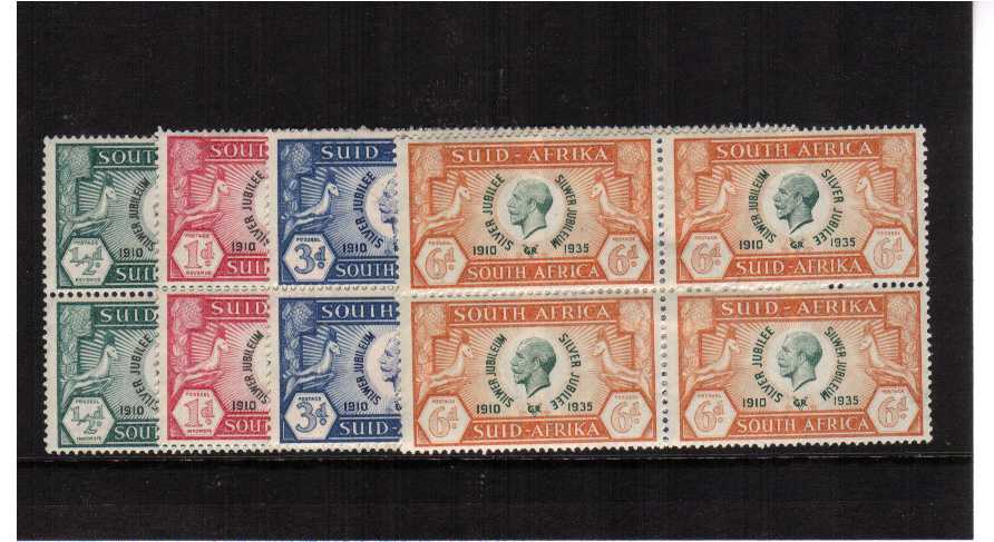Silver Jubilee set of four in se-tenent blocks of four mounted mint.<br/><b>SEARCH CODE: 1935JUBILEE</b>