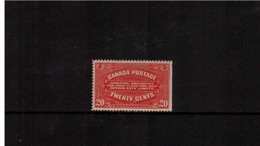 Special Delivery<br/>
20c Carmine Red. A lightly mounted mint single with a right side margin straight edge. 
<br/><b>XQX</b>