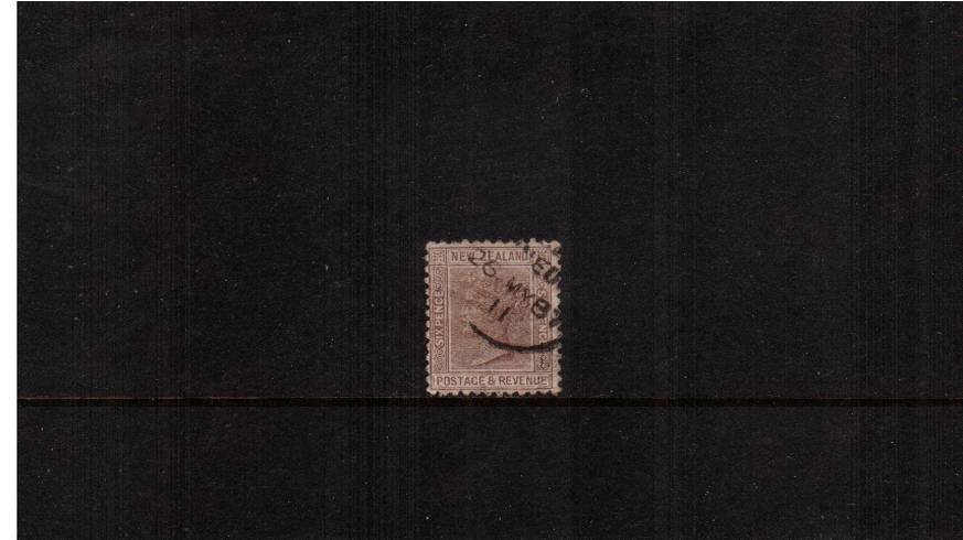 6d Brown  - Watermark NZ Star (6mm) - Perforation 12x11<br/>
A fine lightly cancelled single showing part of a DCS dated 26 MY 87.


<br/><b>QSQ</b>