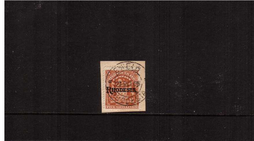 The 5/- Orange overprinted ''RHODESIA'' cancelled with a crisp upright double ring CDS for GWELO - RHODESIA dated 27 OCT 09 tied to a small piece. Lovely!
<br><b>ZKX</b>