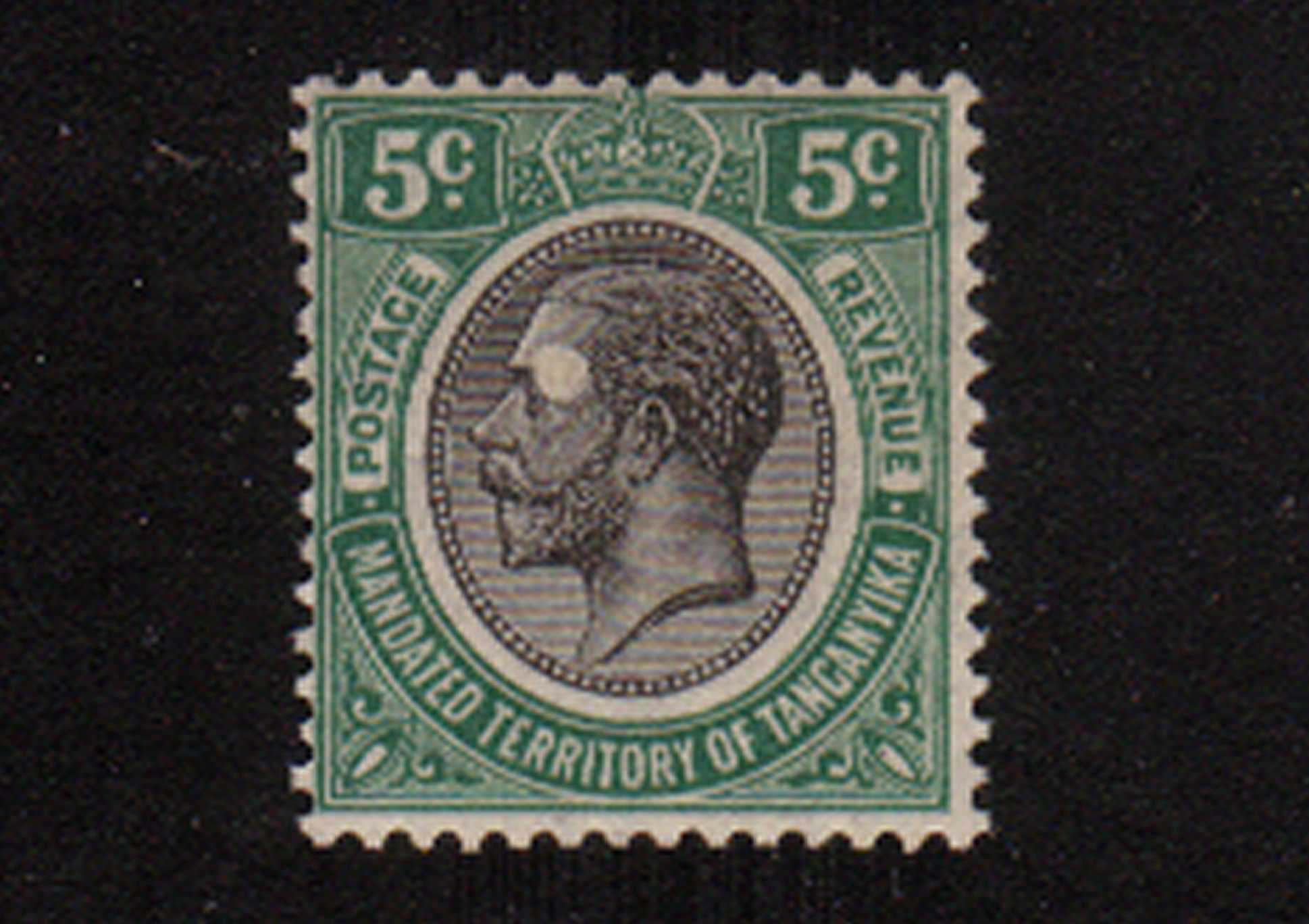 The 5c Green and Black showing a large unprinted area behind the Kings ear. Note this is not a ''scrape'' but a genuine unprinted area. Superb unmounted mint. Almost certainly unique!