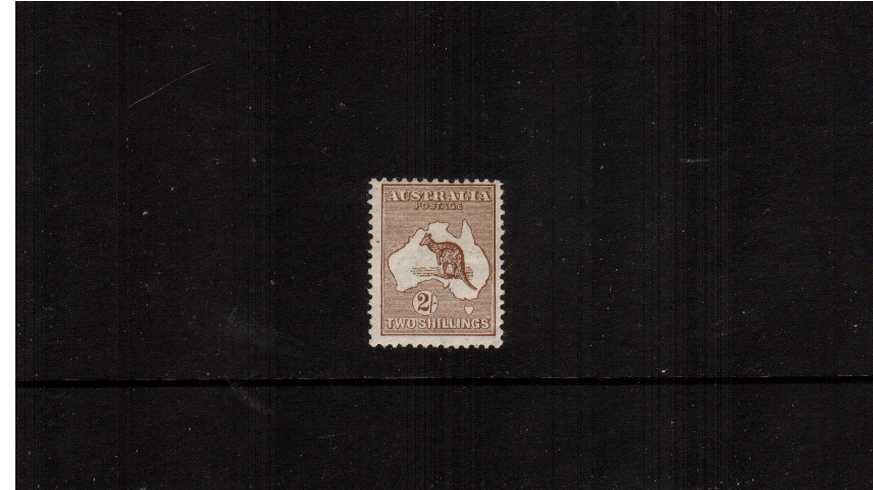 The 2/- Brown - Die II<br/>
A lovely and fresh lightly mounted mint stamp clearly from the first watermark.
<br/><b>ZAZ</b>