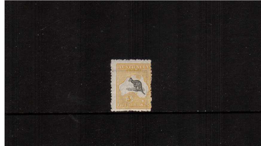 5/- Grey and Yellow - Die II<br/>A very fresh and lightly mounted mint single clearly showing because of the watermark that it was corner of the sheet. Usual very ragged perforations but with nothing missing!