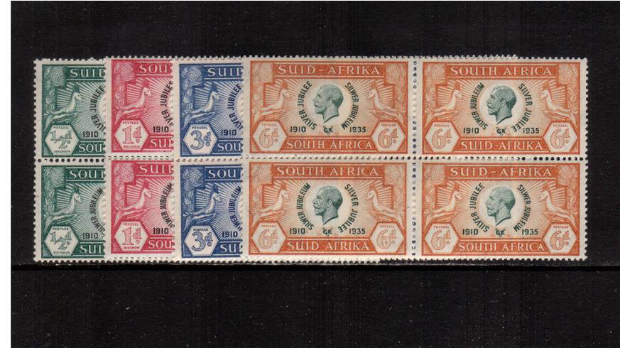 Silver Jubilee set of four in se-tenant pairs as blocks of four superb unmounted mint. 
<br/><b>SEARCH CODE: 1935JUBILEE</b><br/><b>XUX</b>