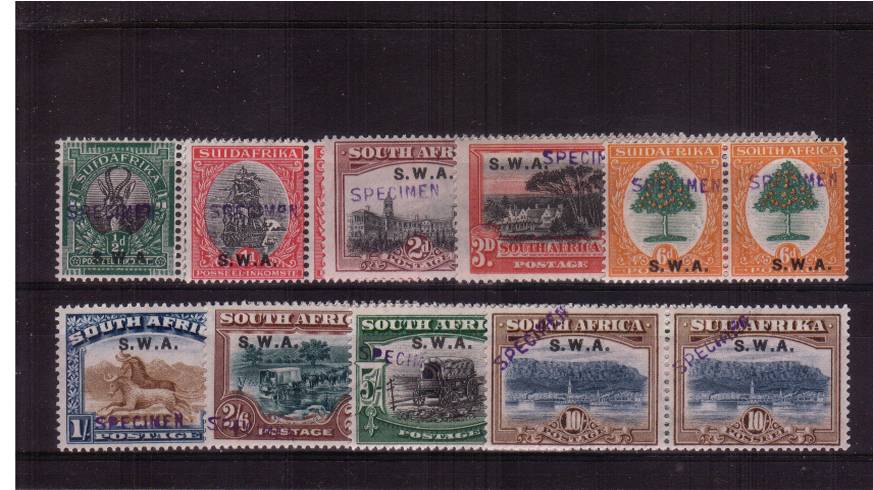 The Pictorials COMPLETE set of nine hand stamped ''SPECIMEN'' fine,<br/>very, very lightly mounted mint. Please note the 4d Brown does not exist<br/>as a ''SPECIMEN'' hence the break in the SG number run.<br/>SG Cat �0.00 
<br/><b>QNX</b>