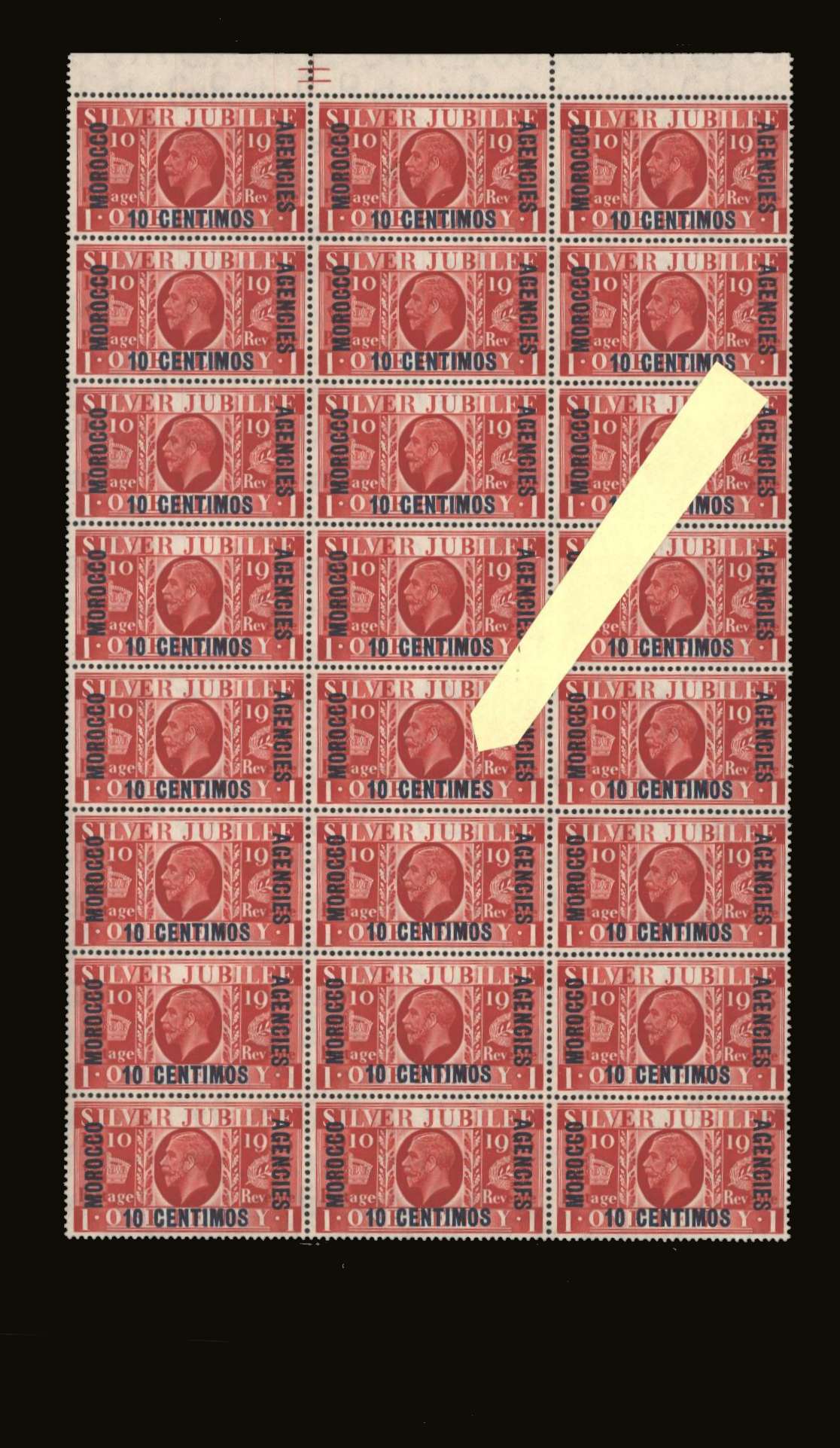 The SILVER JUBILEE 10c on 1d Scarlet.<br/>
A superb unmounted mint top marginal block of twenty-four with a trace of hinge mark on four showing the famous error on a middle column stamp <b>''CENTIMES'' not ''CENTIMOS''</b><br/>SG Cat �1735+